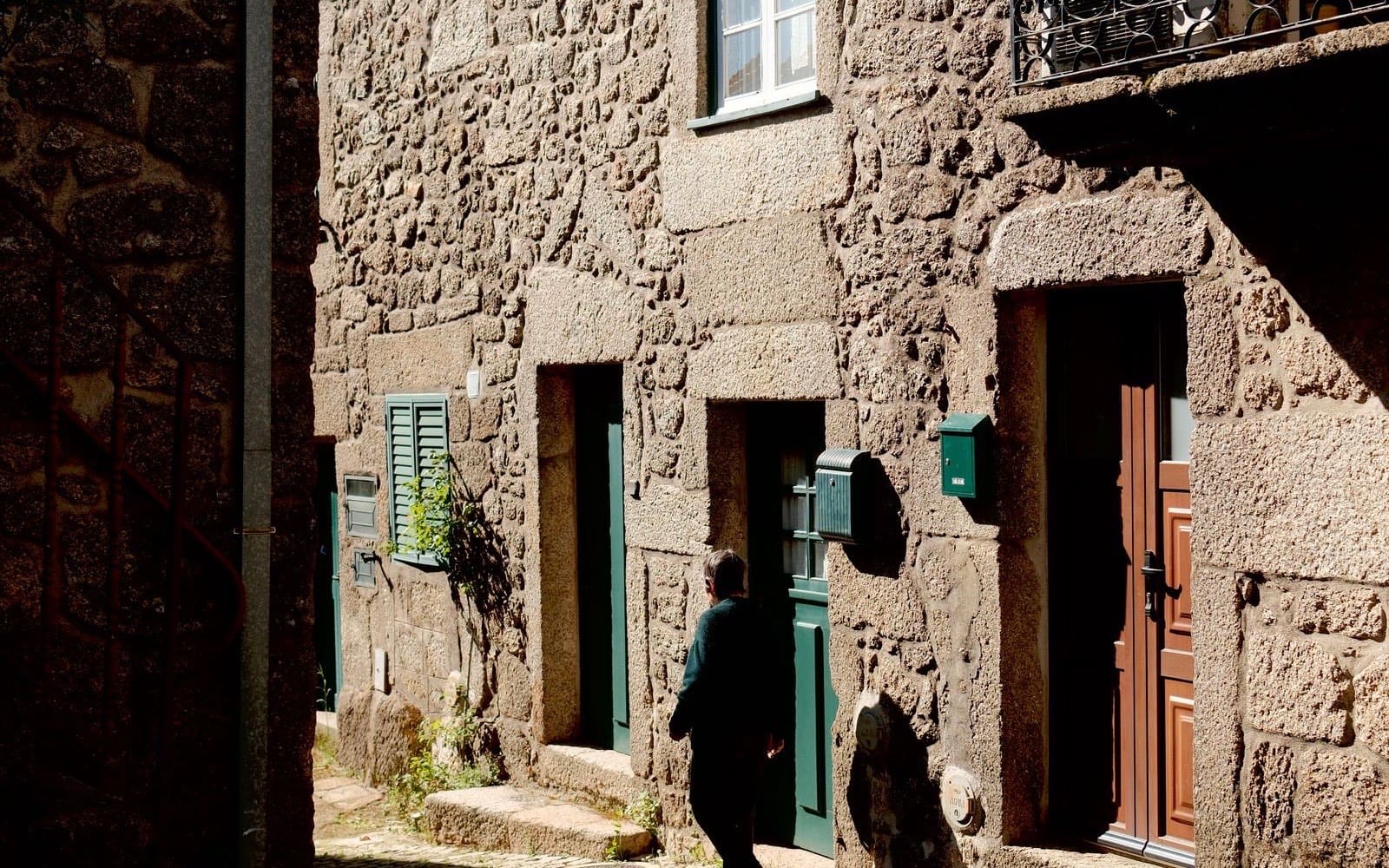 Sunlit stone street in a traditional Portuguese village
