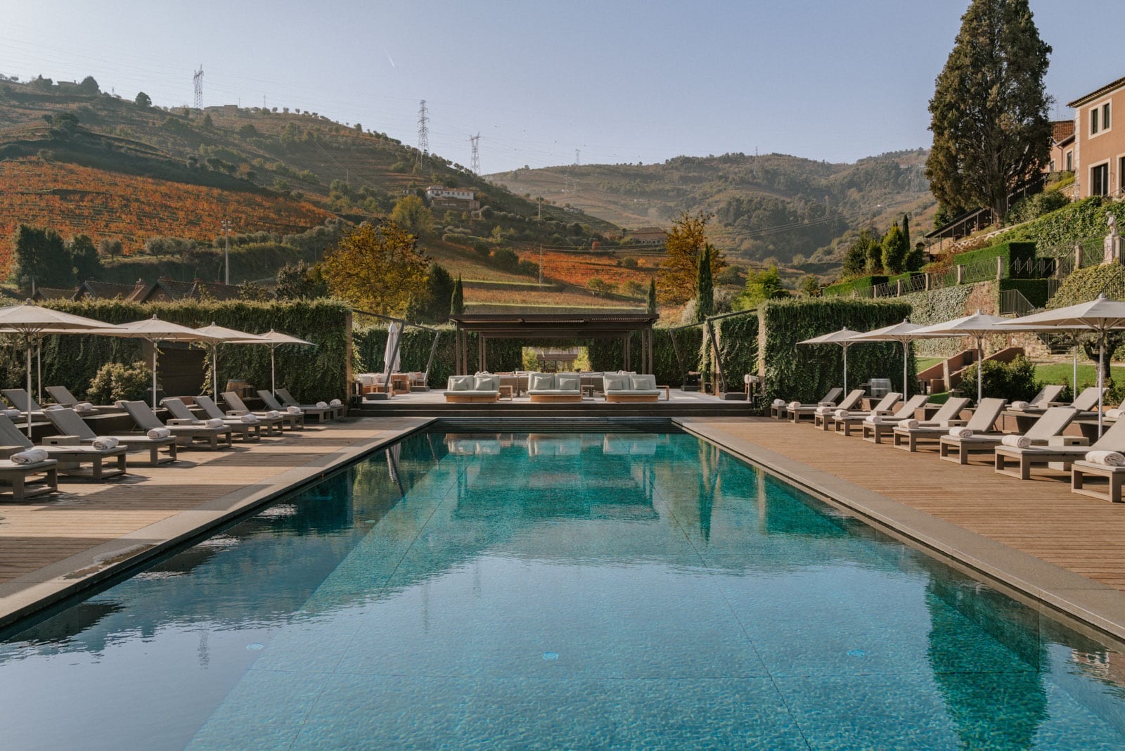 Outdoor pool and vineyard hills at Six Senses Douro Valley